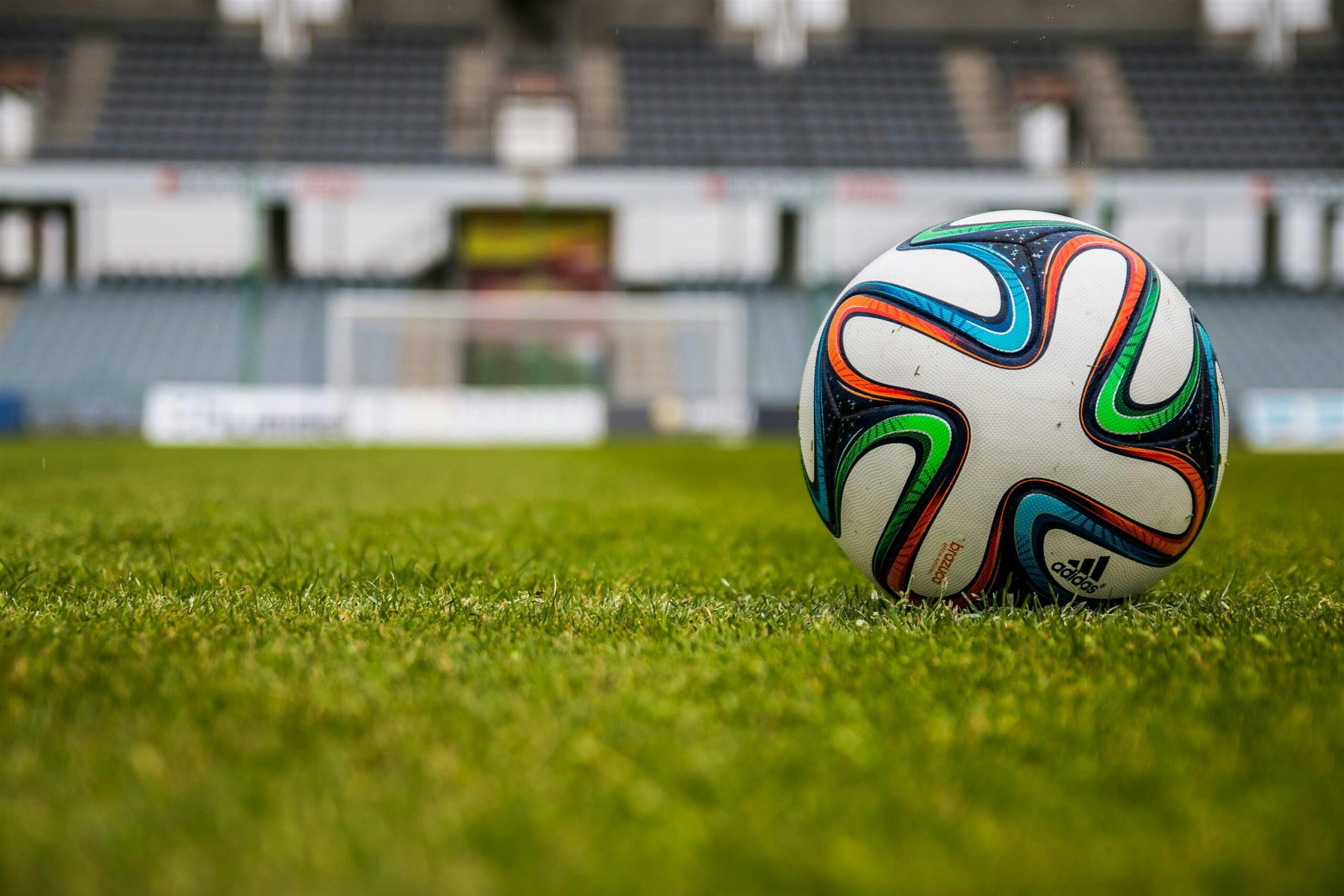 Close up of colorful soccer ball on soccer field